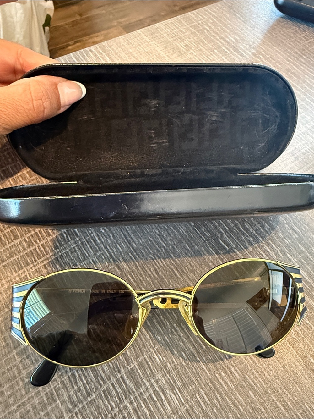 Fendi Gold Metal Round Sunglasses with Black Lenses and Striped Temples